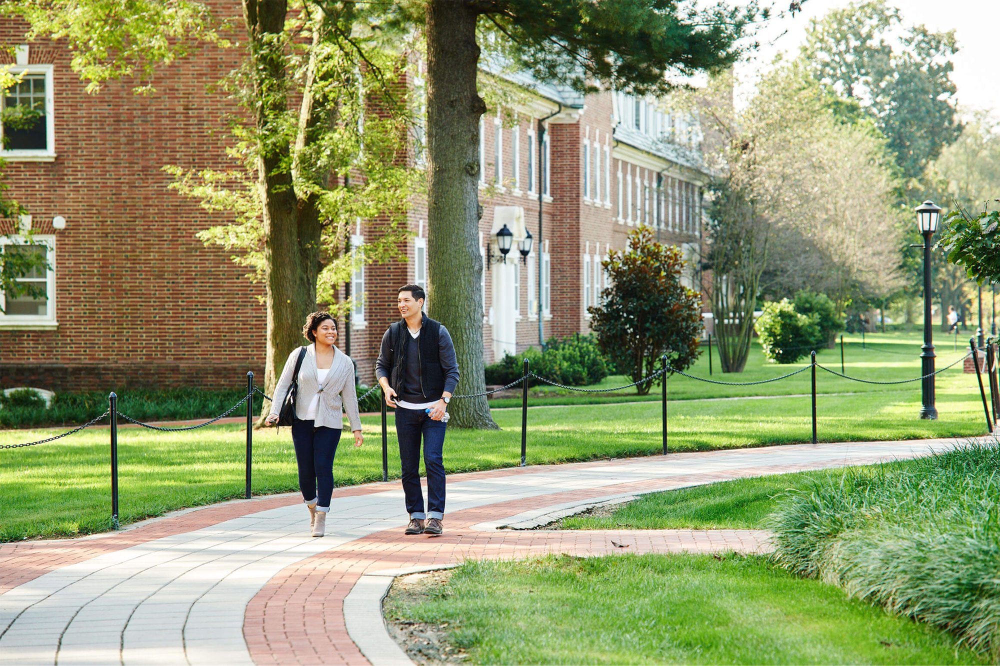 students walking on higher education campus