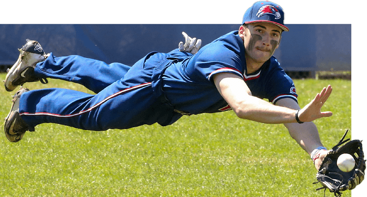 Male college athlete diving to catch a baseball